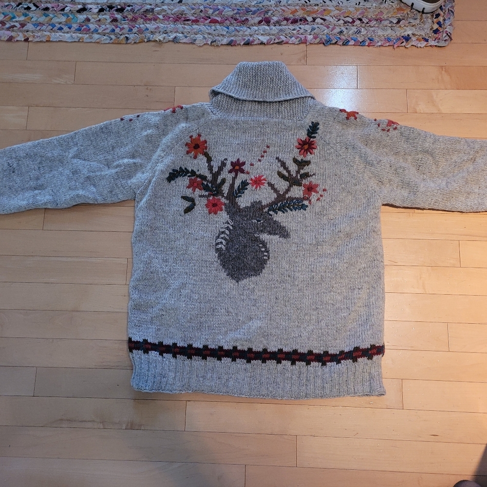 Sundance sweater with zipper, size large with stag head on the back.